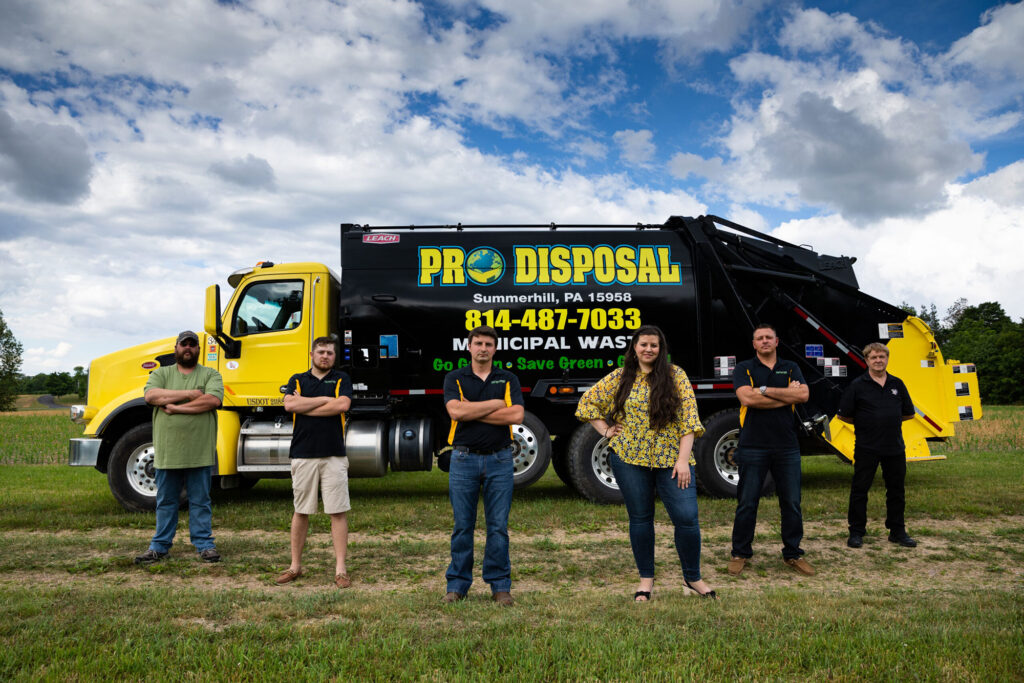 Group of the Pro Disposal Owners standing in front of their truck