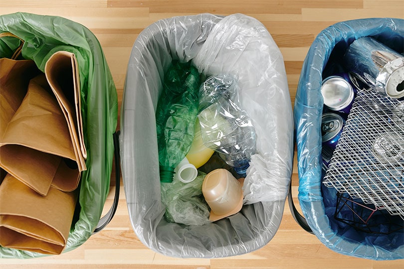 View of three containers with garbage & recycling